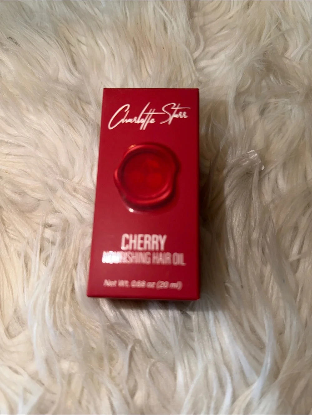 Charlotte Tilbury Cherry Nourishing Hair Oil - red packaging